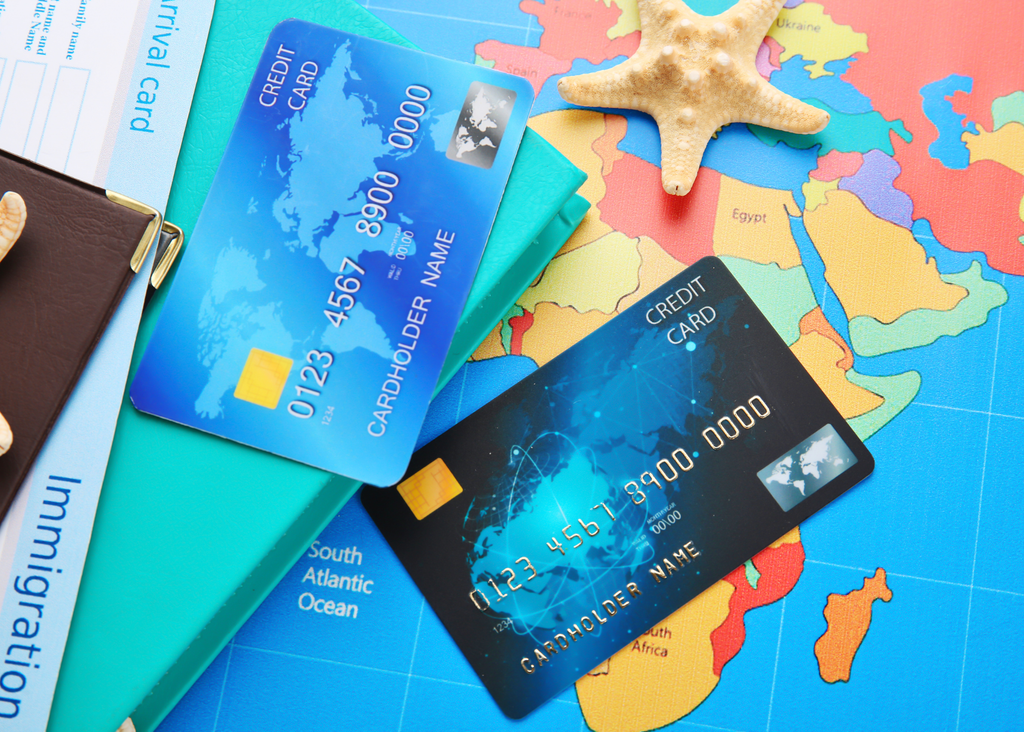 credit cards on top of a world map